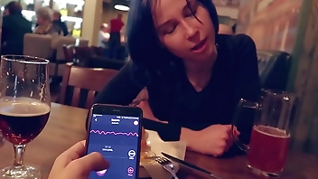 I took control of my stepsister's vibrator in the bar and brought her to orgasm.