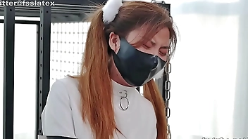 asian latex catsuit woman straitjacket bondage