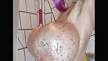 Penelope Black Diamond showing her huge oiled tits with sparkling