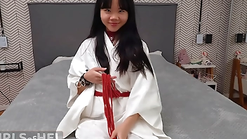 Baebi Hel opens legs wide trying on leather bondage gear