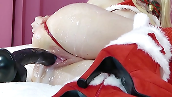Miss Santa gets a nasty Machine fuck with a big ejaculating Dildo in her Pussy