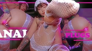 Tattoo girl training her ass with three different plugs