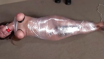 Indica Flower all wrapped up in cling wrap with a vibrator.