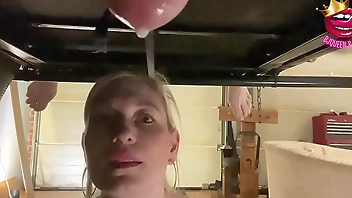 Close up ruined multiple times into a glass on milking table