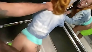 I lowered the redheaded neighbor's pants inside the elevator and put the dick in her pink pussy